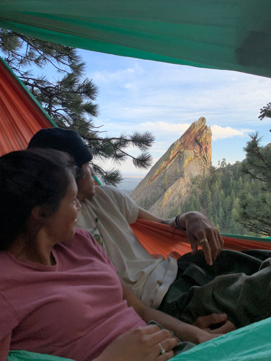 Couple in Mr. Mocks hammock with mountain view